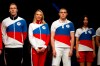 Athletes display the Olympic uniforms for Russian athletes in Moscow, Russia, Wednesday, April 14, 2021. Russia presents its Olympic kit for the Tokyo Games, which shouldn't depict any symbols of the country. Russian athletes will compete at the Tokyo Olympics as neutral after the Court of Arbitration for Sport last December banned Russia from using its name, flag and anthem at any world championships for the next two years because of state-backed doping. (AP Photo/Pavel Golovkin)