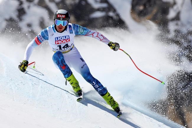 United States' Bryce Bennett speeds down the course during a men's downhill training, at the alpine ski World Championships, in Cortina d'Ampezzo, Italy, Friday, Feb. 12, 2021. (AP Photo/Marco Trovati)