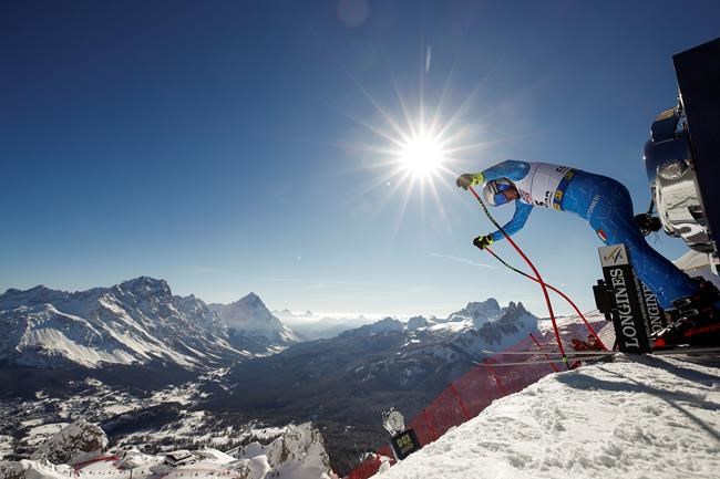 Italy's Dominik Paris prepares to start a men's downhill training, at the alpine ski World Championships, in Cortina d'Ampezzo, Italy, Friday, Feb. 12, 2021. (AP Photo/Gabriele Facciotti)