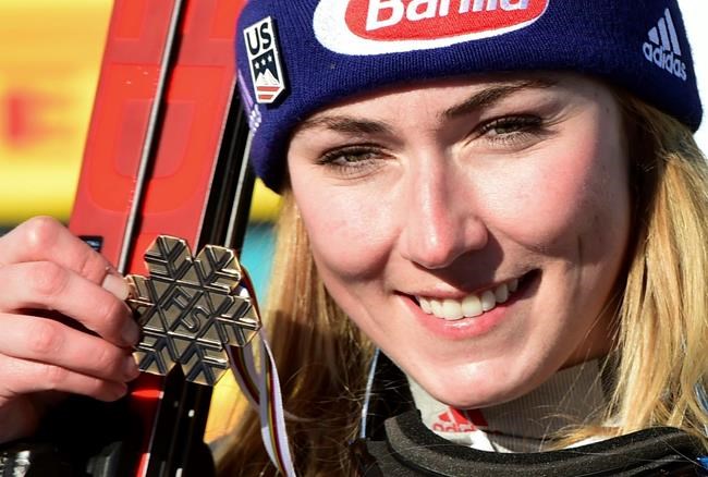 United States' Mikaela Shiffrin shows her bronze medal in the women's super-G, at the alpine ski World Championships, in Cortina d'Ampezzo, Italy, Thursday, Feb. 11, 2021. (AP Photo/Marco Tacca)