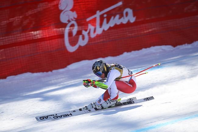 Switzerland's Lara Gut-Behrami speeds down the course during a women's downhill training, at the alpine ski World Championships, in Cortina d'Ampezzo, Italy, Friday, Feb. 12, 2021. (AP Photo/Marco Trovati)