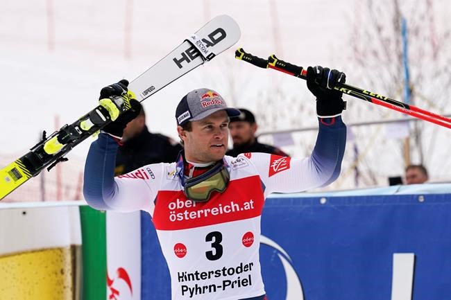 France's Alexis Pinturault celebrates winning an alpine ski, men's World Cup giant slalom, in Hinterstoder, Austria, Monday, March 2, 2020. (AP Photo/Giovanni Auletta)