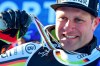 Germany's Romed Baumann shows his silver medal for the men's super-G, at the alpine ski World Championships, in Cortina d'Ampezzo, Italy, Thursday, Feb. 11, 2021. (AP Photo/Marco Tacca)
