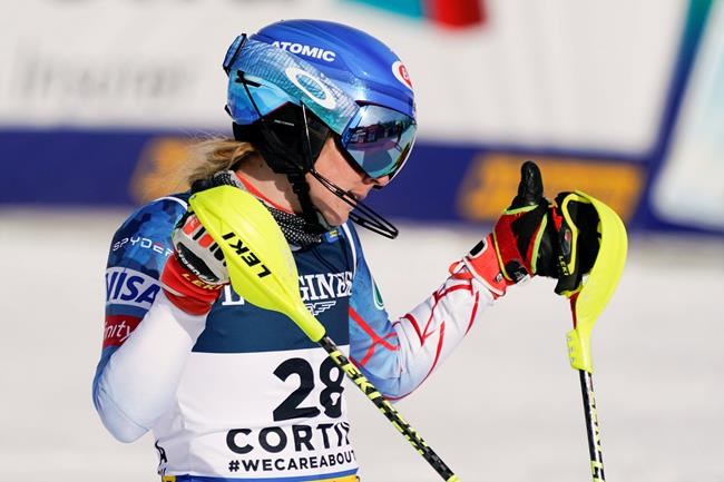 United States' Mikaela Shiffrin celebrates at the finish area of the slalom portion of the women's combined race, at the alpine ski World Championships, in Cortina d'Ampezzo, Italy, Monday, Feb. 15, 2021. (AP Photo/Giovanni Auletta)