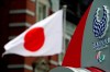 A Japanese flag is seen near Tokyo 2020 Paralympic logo at Tokyo Station in Tokyo Tuesday, April 21, 2020. An open conflict broke out Tuesday between Tokyo Olympic organizers and the IOC over how much to divulge about who will pay for the unprecedented year-long postponement. (AP Photo/Eugene Hoshiko)