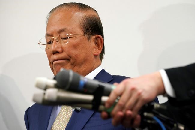 Toshiro Muto, CEO of the Tokyo 2020 Organizing Committee, listens to reporters' questions during a news conference in Tokyo Tuesday, March 17, 2020. Tokyo Olympic organizers are pushing ahead with the Japanese leg of the torch relay that opens on March 26 despite the threat of the spreading coronavirus. Muto said that crowds will not be prohibited from gathering on the roadside. But he asked for restraint and warned the relay could be stopped or delayed. (AP Photo/Eugene Hoshiko)