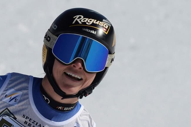 Switzerland's Lara Gut-Behrami reacts after completing an alpine ski, women's World Cup downhill, in Val di Fassa, Italy, Friday, Feb. 26, 2021. (AP Photo/Elvis Piazza)