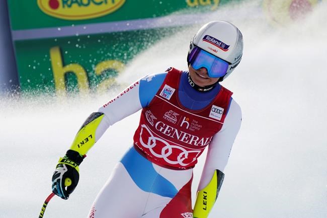 Switzerland's Corinne Suter reacts at finish line after completing an alpine ski women's World Cup Super G in Val d'Isere, France, Sunday, Dec. 20, 2020. (AP Photo/Giovanni Auletta)