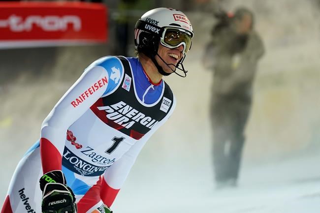 Switzerland's Ramon Zenhaeusern reacts after completing an alpine ski, men's World Cup slalom in Zagreb, Croatia, Sunday, Jan. 5, 2020. (AP Photo/Giovanni Auletta)