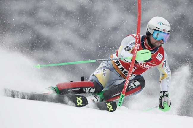 Norway's Sebastian Foss Solevaag speeds down the slope during an alpine ski, men's World Cup slalom in Flachau, Austria, Sunday, Jan. 17, 2021. (AP Photo/Gabriele Facciotti)