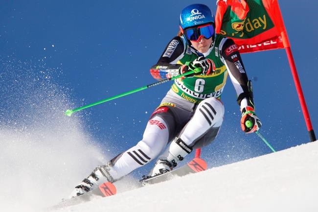 Slovakia's Petra Vlhova speeds down the course during an alpine ski women's World Cup giant slalom in Courchevel, France, Monday, Dec. 14, 2020. (AP Photo/Gabriele Facciotti)