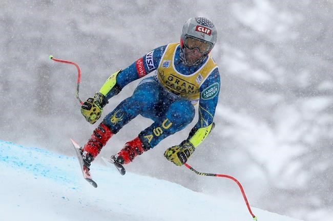 United States' Travis Ganong speeds down the course during an alpine ski men's World Cup Super G in Val d' Isere, France, Saturday, Dec. 12, 2020. (AP Photo/Gabriele Facciotti)