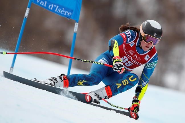 United States' Keely Cashman speeds down the course during an alpine ski women's World Cup Super G in Val d'Isere, France, Sunday, Dec. 20, 2020. (AP Photo/Gabriele Facciotti)