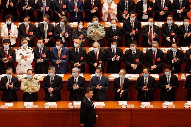 Chinese President Xi Jinping, bottom, arrives for the closing session of the Chinese People's Political Consultative Conference (CPPCC) at the Great Hall of the People in Beijing on Wednesday, May 27, 2020. (AP Photo/Andy Wong)