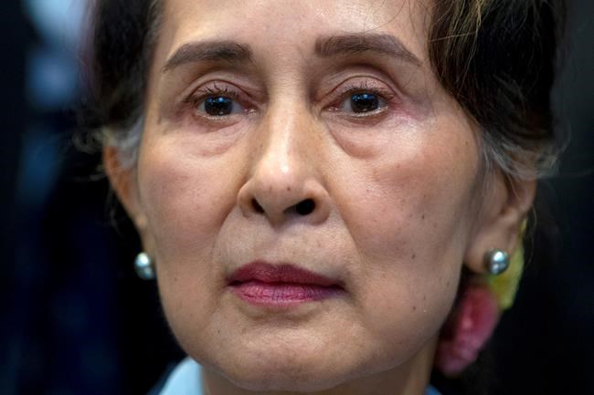 FILE - In this Dec. 11, 2019, file photo, Myanmar's leader Aung San Suu Kyi waits to address judges of the International Court of Justice on the second day of three days of hearings in The Hague, Netherlands. Reports says Monday, Feb. 1, 2021 a military coup has taken place in Myanmar and Suu Kyi has been detained under house arrest. (AP Photo/Peter Dejong, File)