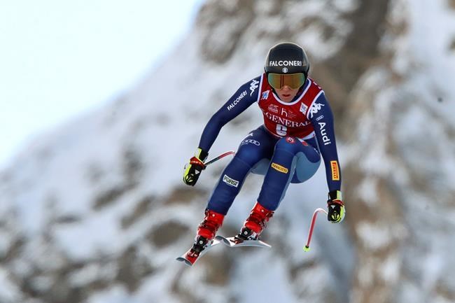 Italy's Sofia Goggia speeds down the course during an alpine ski, women's World Cup Downhill, in Val d'Isere, France, Friday, Dec.18, 2020. (AP Photo/Gabriele Facciotti)
