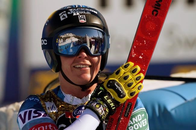 United States' Breezy Johnson gestures after she gets to the finish area after completing the women's downhill, at the alpine ski World Championships in Cortina d'Ampezzo, Italy, Saturday, Feb. 13, 2021. (AP Photo/Giovanni Auletta)