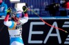 Switzerland's Corinne Suter celebrates as she gets to the finish area after completing the women's downhill, at the alpine ski World Championships in Cortina d'Ampezzo, Italy, Saturday, Feb. 13, 2021. (AP Photo/Giovanni Auletta)
