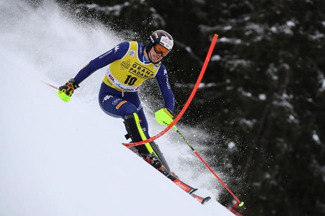 Italy's Alex Vinatzer speeds down the course during an alpine ski, men's World Cup slalom in Alta Badia, Italy, Monday, Dec.21, 2020. (AP Photo/Marco Trovati)