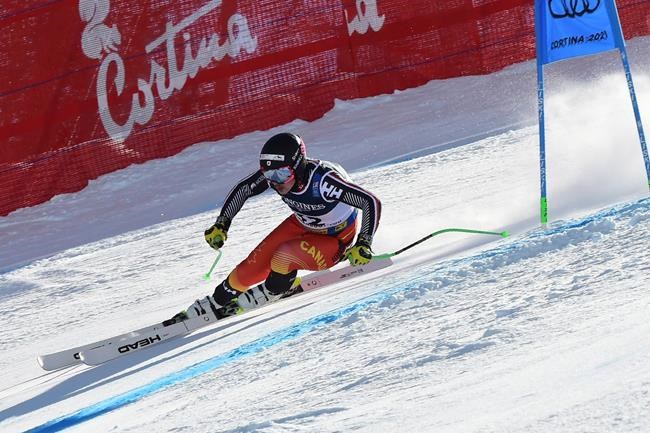 Canada's James Crawford speeds down the course during the super G portion of the men's combined race, at the alpine ski World Championships, in Cortina d'Ampezzo, Italy, Monday, Feb. 15, 2021. (AP Photo/Marco Tacca)