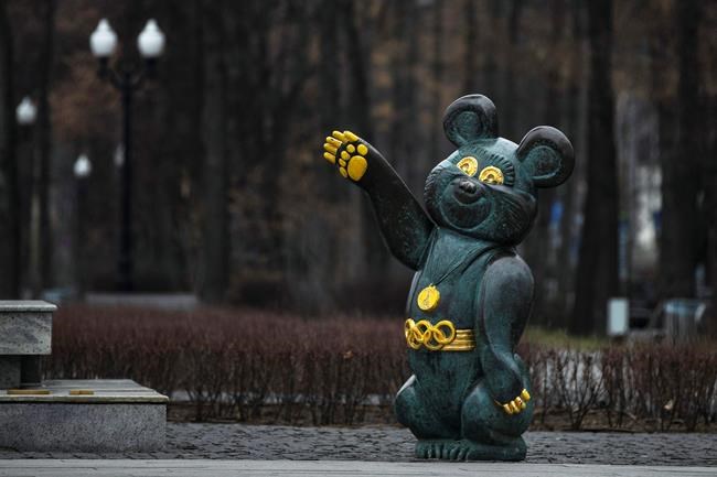 A monument to Misha the Bear, the mascot of the Moscow 1980 Olympic Games, in a park in Moscow, Russia, Monday, Dec. 9, 2019. The World Anti-Doping Agency has banned Russia from the Olympics and other major sporting events for four years, though many athletes will likely be allowed to compete as neutral athletes. (AP Photo/Pavel Golovkin)