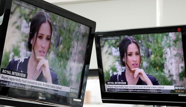 Australian television news in Sydney, Monday, March 8, 2021, reports on an interview of The Duke and Duchess of Sussex by Oprah Winfrey. The interview airs in Australia Monday evening. (AP Photo/Rick Rycroft)