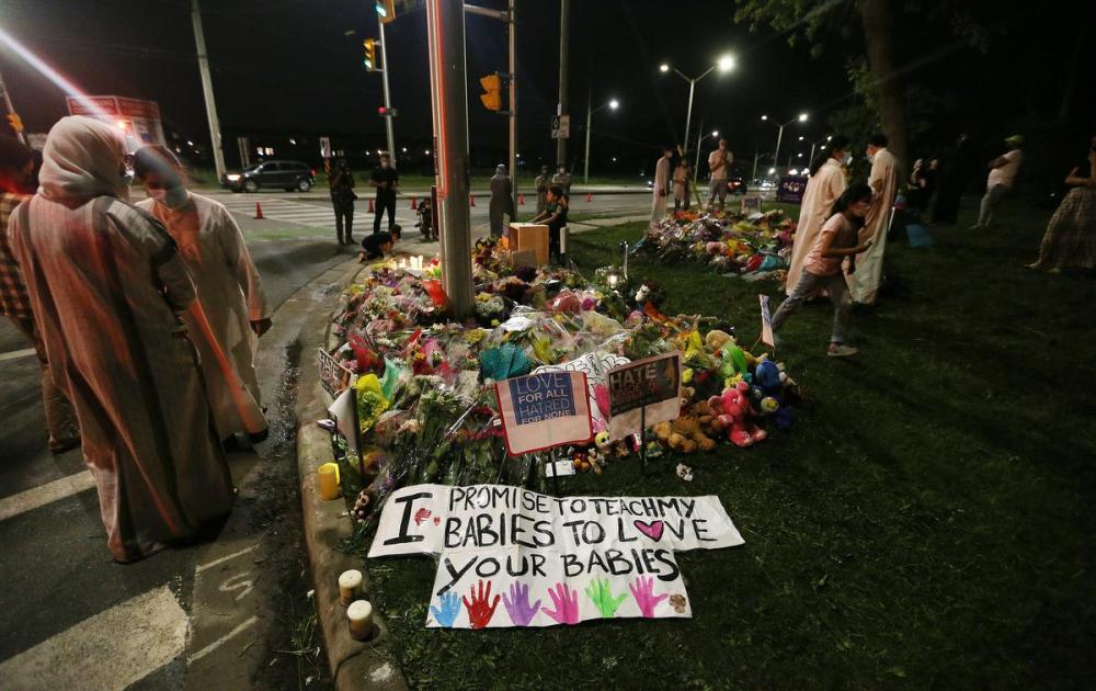 Steve Russell - Toronto Star
People return to the scene to leave flowers and light candles after a vigil for a Muslim family that was killed when a 20-year-old man ran them down with his vehicle at a crosswalk in London, Ont. in what the police say was an hate-motivated act.