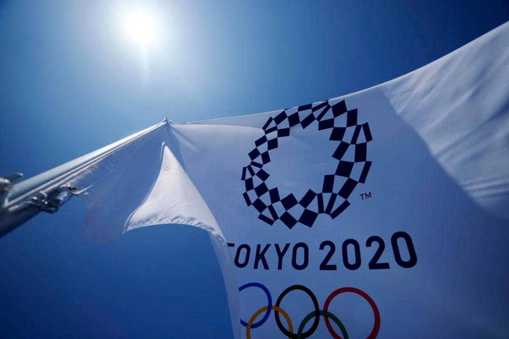 Kiichiro Sato - AP
A Tokyo 2020 Olympic flag flies over the top of the bleachers at Ariake Tennis Center on Monday in Tokyo.