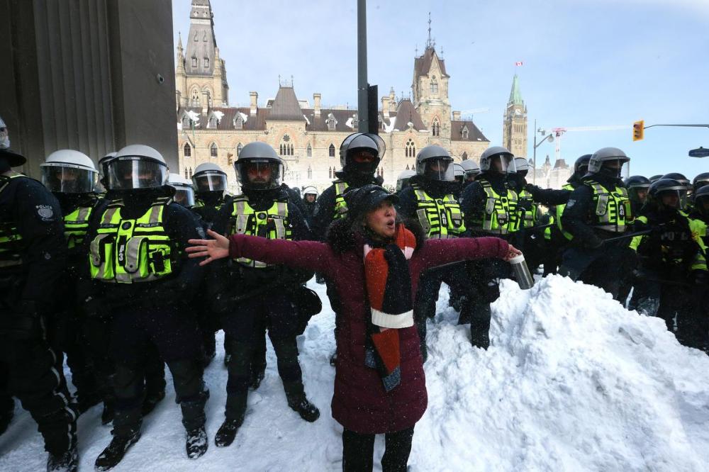 Steve Russell - Toronto Star
A protester stands in front of police. Protesters from the