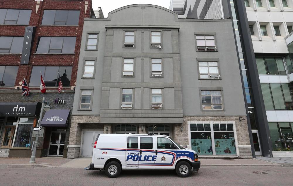 Steve Russell - Toronto Star
A London police van parked outside the downtown London apartment building where the accused killer lived.