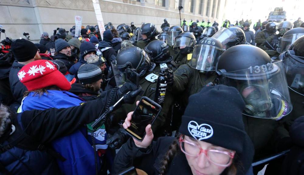 Steve Russell - Toronto Star
Police threaten the use of pepper spray as they move protesters down O'Connor Street away from Wellington.