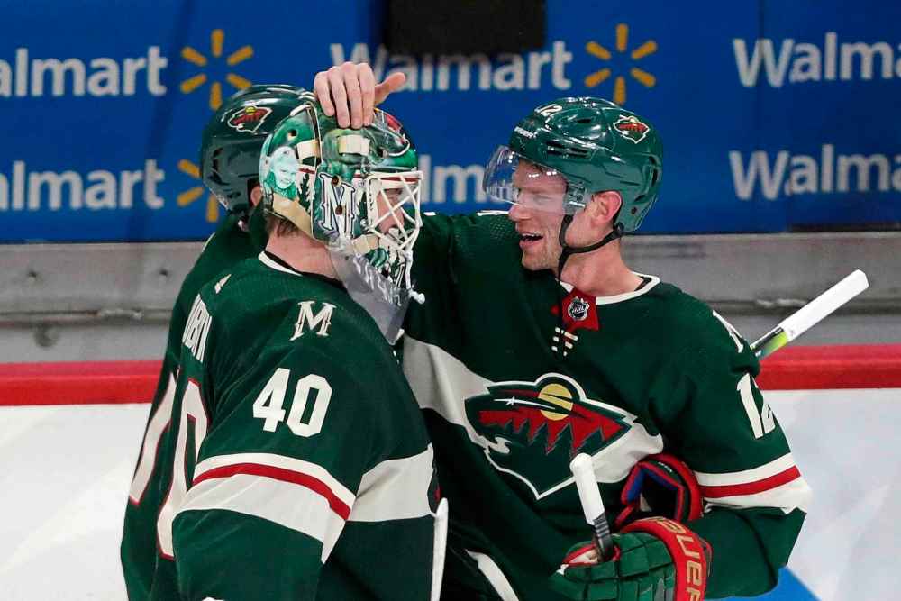 CP
Minnesota Wild center Eric Staal (12) celebrates with Minnesota Wild goalie Devan Dubnyk (40) after defeating the Winnipeg Jets in overtime. (Andy Clayton-King/The Associated Press)
