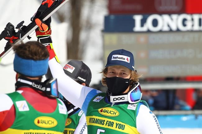 Marco Odermatt of Switzerland celebrates in the finish area after winning an alpine ski, World Cup men's giant slalom in Kranjska Gora, Slovenia, Saturday, March 13, 2021. (AP Photo/Marco Trovati)