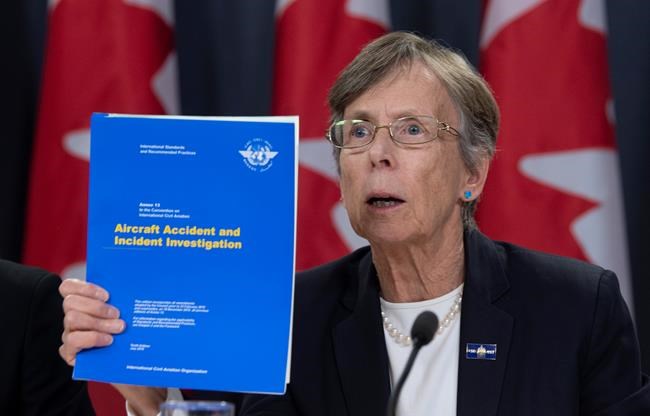 Transportation Safety Chair Kathy Fox holds up a document as she speaks about the Iran plane crash during a news conference in Ottawa, Monday, January 13, 2020. THE CANADIAN PRESS/Adrian Wyld