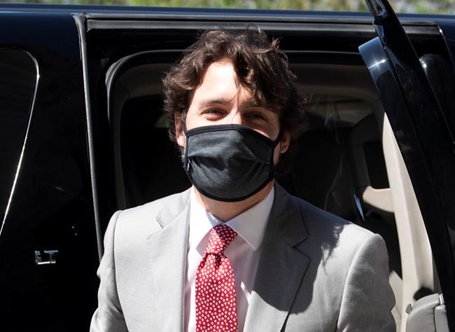 Prime Minister Justin Trudeau arrives on Parliament Hill in Ottawa, Wednesday, May 20, 2020. THE CANADIAN PRESS/Adrian Wyld