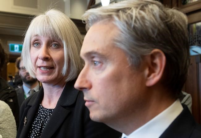 Foreign Affairs Minister Francois-Philippe Champagne looks on as Minister of Health Patty Hajdu responds to a question as they speak with the media about coronavirus, Wednesday, January 29, 2020 in Ottawa. THE CANADIAN PRESS/Adrian Wyld