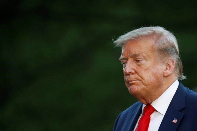 President Donald Trump walks across the South Lawn of the White House in Washington, Saturday, May 30, 2020, after stepping off Marine One as he returns from Kennedy Space Center for the SpaceX Falcon 9 launch. (AP Photo/Patrick Semansky)