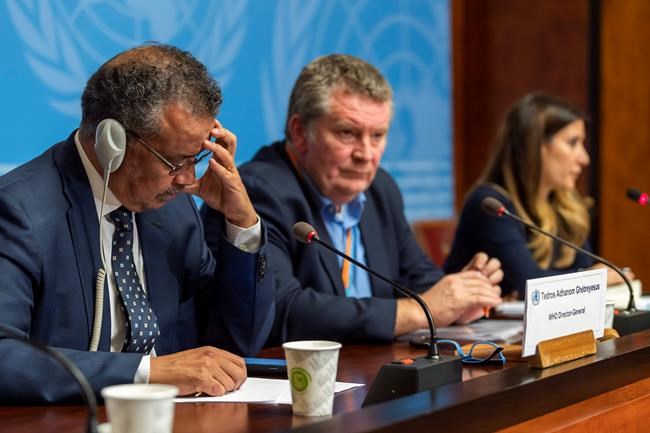 WHO executives, from left, Tedros Adhanom Ghebreyesus, Director General of the World Health Organization (WHO) with Michael Ryan, Executive Director, WHO Health Emergencies Programme, and Maria van Kerkhove, Head of the Outbreak Investigation Task Force, during a press conference about the new Coronavirus, at the European headquarters of the United Nations in Geneva, Switzerland, Wednesday, Jan. 29, 2020. Efforts to contain a new and deadly virus have intensified Wednesday, as quarantine facilities are set up, many airlines have suspended or significantly cut back flights from China and efforts continue to find a medical remedy. (Martial Trezzini/Keystone via AP)