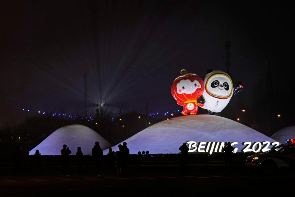 Ng Han Guan - AP
Residents past near the Paralympic mascot Shuey Rhon Rhon left, and Winter Olympic mascot Bing Dwen Dwen displayed near the iconic Bird's Nest stadium where a rehearsal for the opening ceremony of the 2022 Beijing Games took place Sunday.
