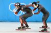WANG ZHAO - AFP via GETTY IMAGES
Canada's Kim Boutin pushes teammate Courtney Sarault in a semifinal heat of the women's 3,000-metre relay short-track speedskating event on Feb. 9, 2022.