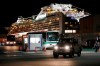 Buses carrying Israeli passengers from the quarantined Diamond Princess cruise ship leave a port in Yokohama, near Tokyo, Thursday, Feb. 20, 2020. Passengers tested negative for COVID-19 started disembarking since Wednesday. (AP Photo/Eugene Hoshiko)