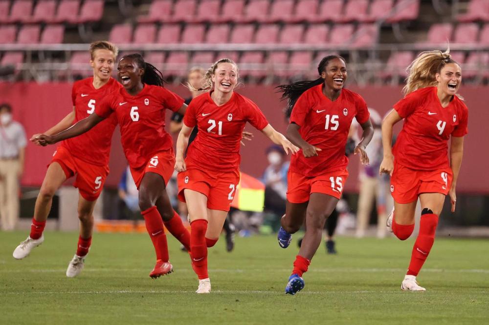 Atsushi Tomura - GETTY IMAGES file photo
Quinn, Deanne Rose, Gabrielle Carle, Nichelle Prince and Shelina Zadorsky storm the field at the end of Canada’s soccer semifinal win over the United States.