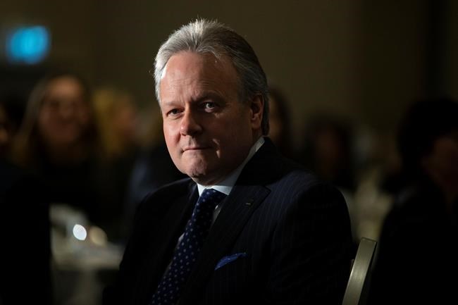Bank of Canada governor Stephen Poloz listens to his introduction before speaking at an event in Toronto, on Thursday March 5, 2020. THE CANADIAN PRESS/Chris Young