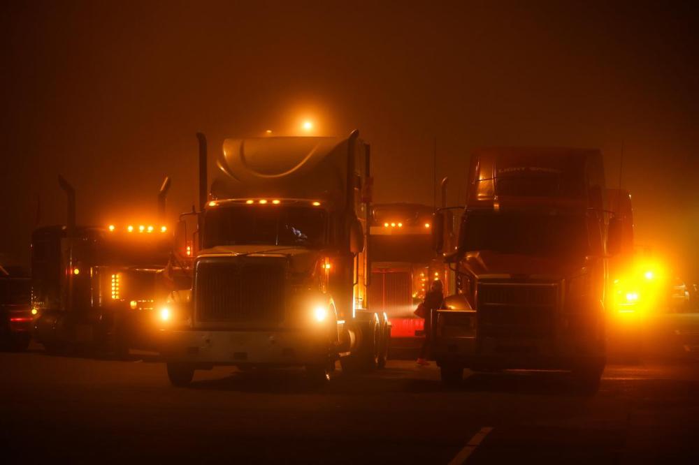 DARRYL DYCK - THE CANADIAN PRESS
Truckers prepare to depart on a cross-country convoy destined for Ottawa to protest a federal vaccine mandate for truckers, in Delta, B.C., on Sunday.