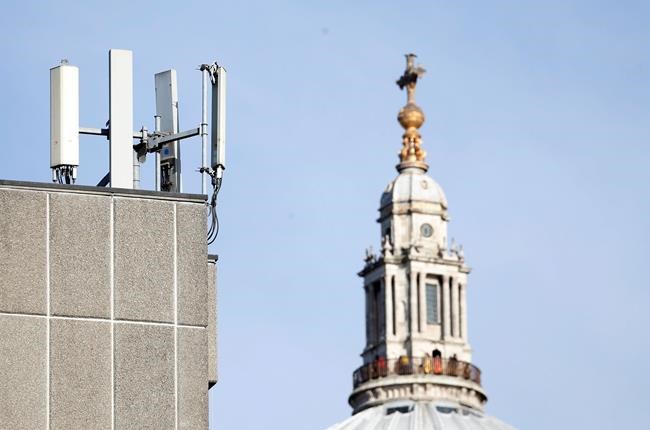 Mobile network phone masts are visible in front of St Paul's Cathedral in the City of London, Tuesday, Jan. 28, 2020. The Chinese tech firm Huawei has been designated a