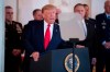 President Donald Trump addresses the nation from the White House on the ballistic missile strike that Iran launched against Iraqi air bases housing U.S. troops, Wednesday, Jan. 8, 2020, in Washington, accompanied by Vice President Mike Pence, Secretary of State Mike Pompeo, and others. (AP Photo/Alex Brandon)