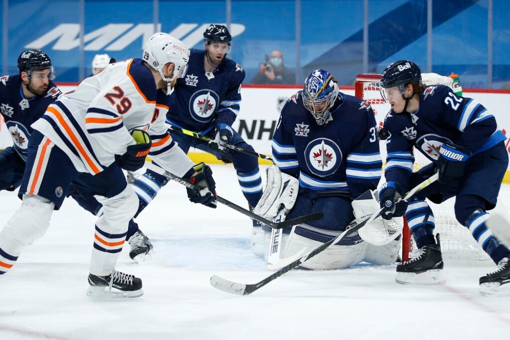 CP
Connor Hellebuyck is going to have to be stellar in net to deal with the Oilers' firepower. (John Woods / The Canadian Press files)