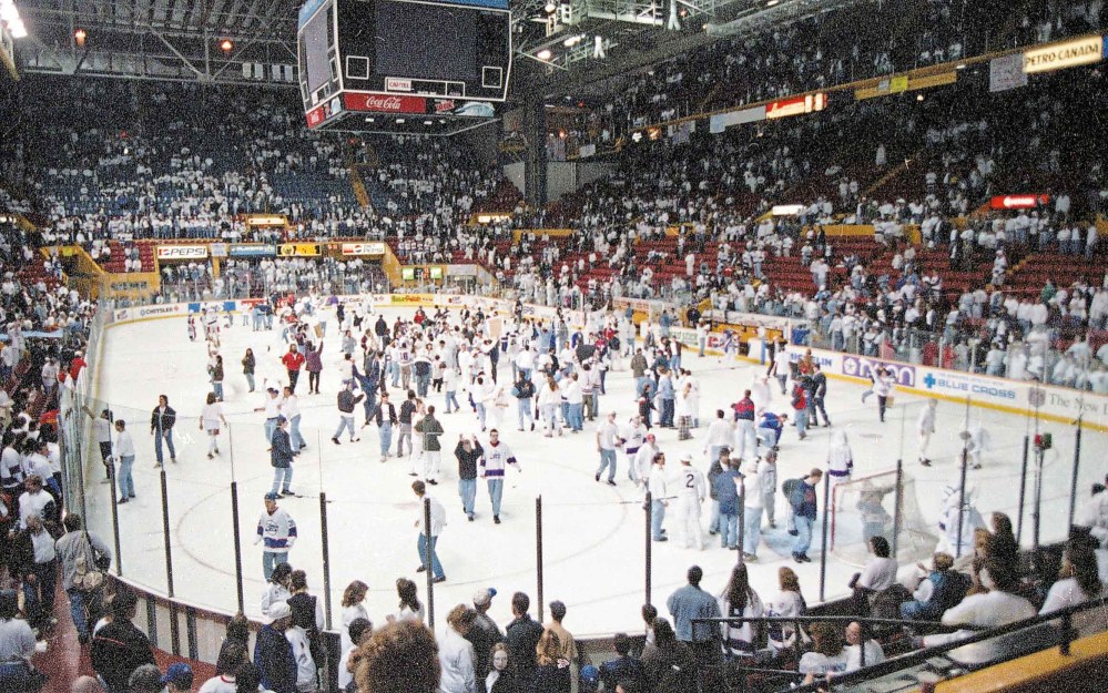 JOE BRYKSA / FREE PRESS FILES
Fans flood the ice after the game.