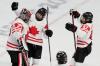 Petr David Josek - AP
Canada goalie Ann-Renee Desbiens celebrates with Emily Clark (26) and Jamie Lee Rattray (47) after a 10-3 win over Switzerland in a women's semifinal hockey game at the 2022 Winter Olympics on Monday