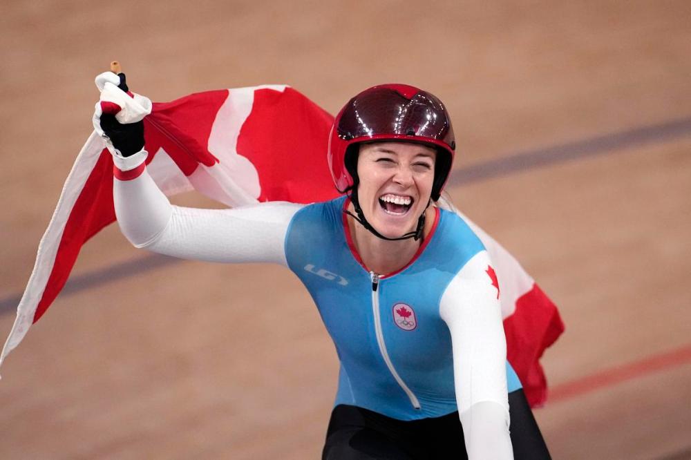Christophe Ena - AP
Kelsey Mitchell of Team Canada celebrates after winning the gold medal during the track cycling women's sprint race at the 2020 Tokyo Games on Sunday.